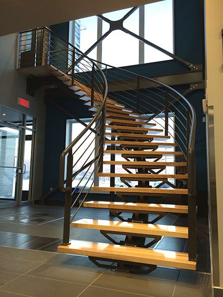 Atelier de Soudure Gilles Roy inc. office staircase with central stringer in painted steel.